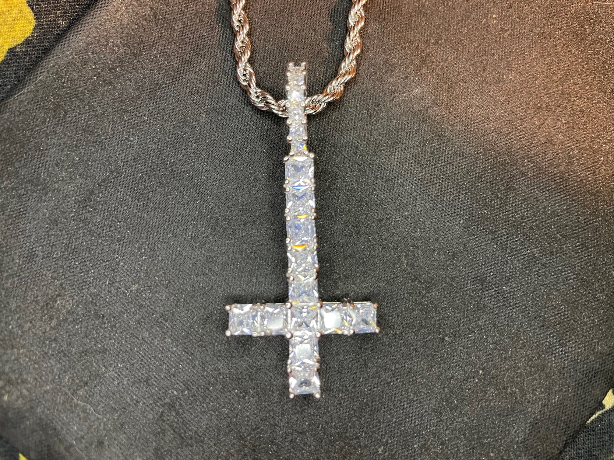 Bling or blasphemy? Upside-down and sideways crosses showing up in fashion  | Chattanooga Times Free Press
